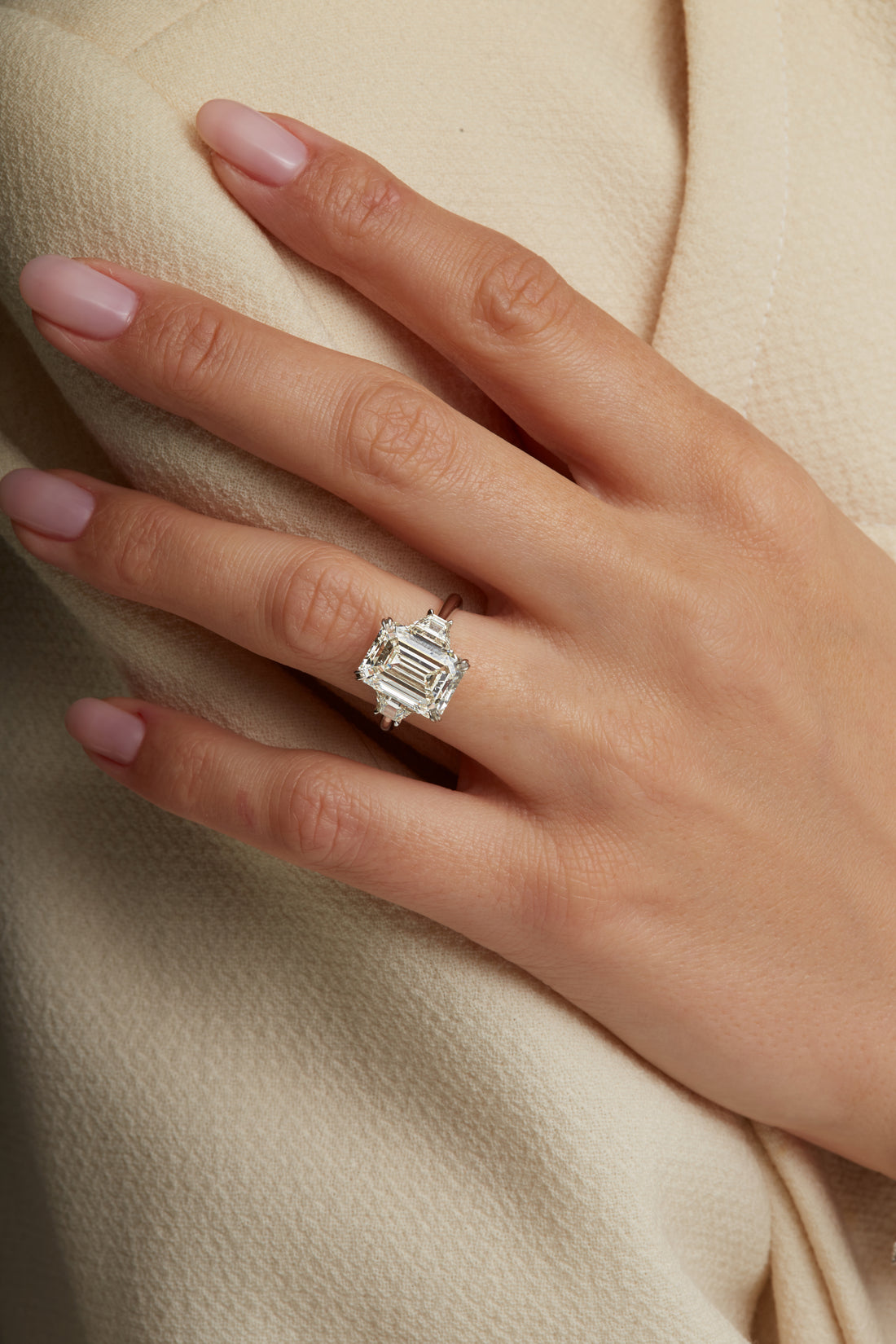 Emerald Cut Diamond and Two Trapezoid Side Stone Ring