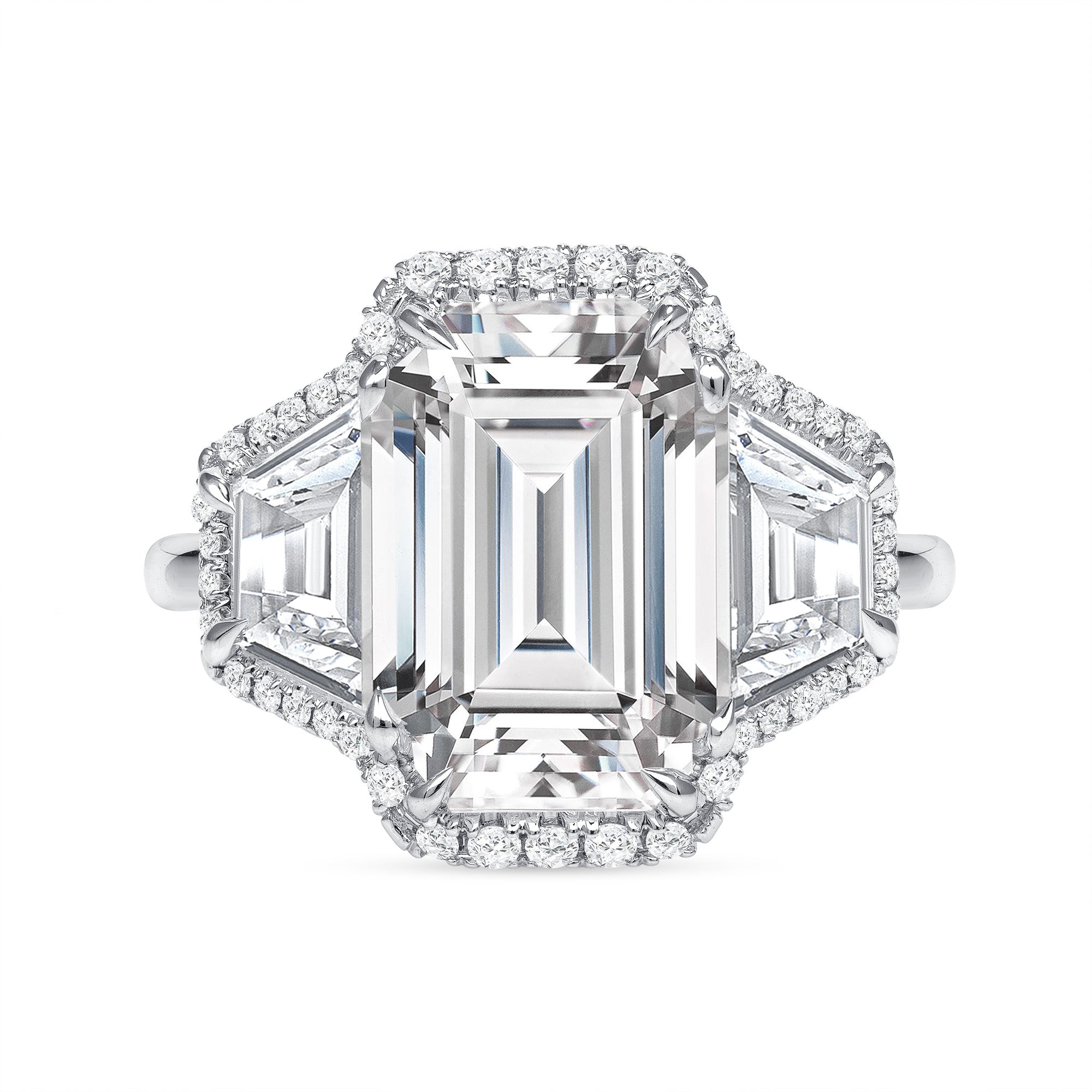 Emerald Cut Diamond and Two Trapezoid Diamonds Halo Ring