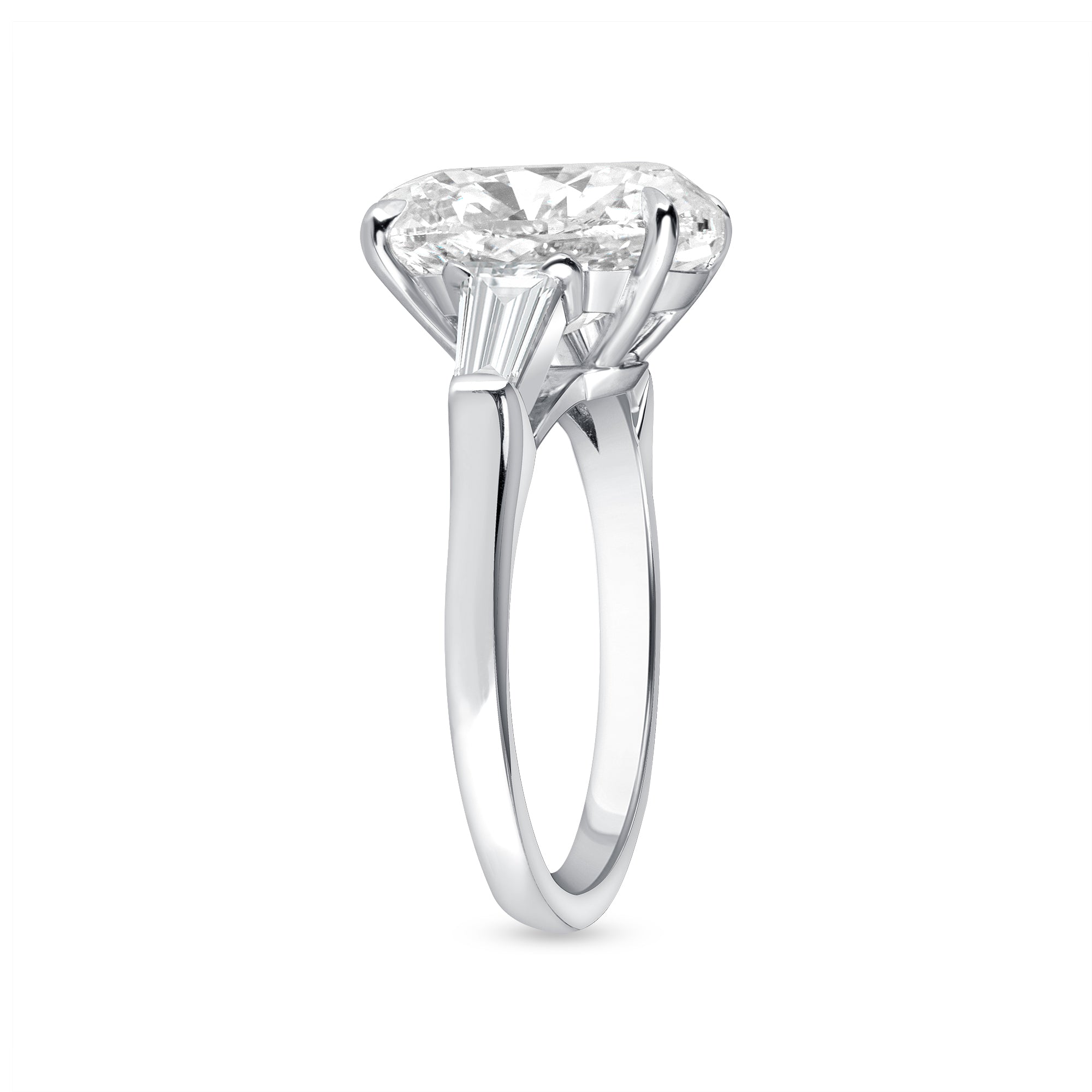 Oval Cut Diamond and Baguette Diamond Side Stone Ring