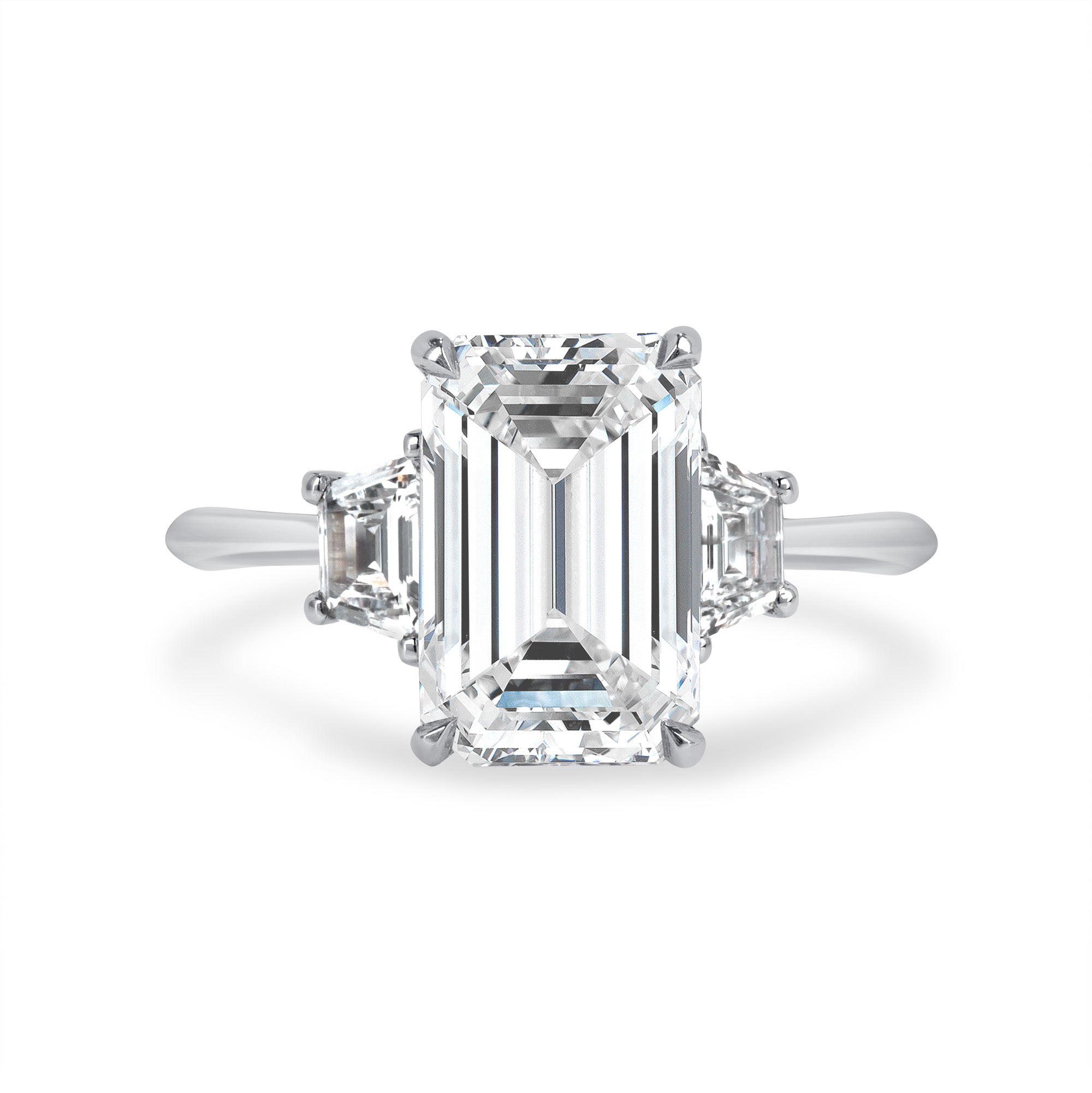 Emerald Cut Diamond and Two Trapezoid Side Stone Ring
