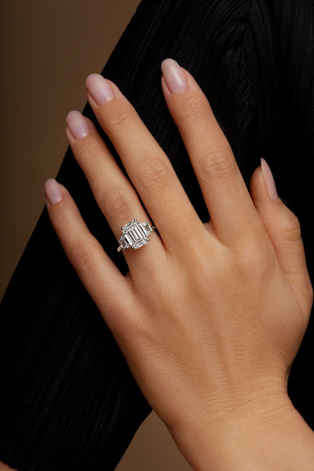 Emerald Cut Diamond Center Stone and Two Trapezoid Shape On the Side 18K White Gold Ring