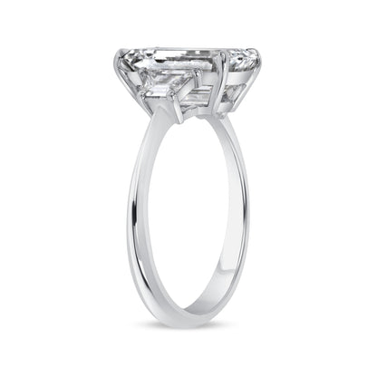 Emerald Cut Diamond and Two Trapezoid Diamonds Platinum Ring